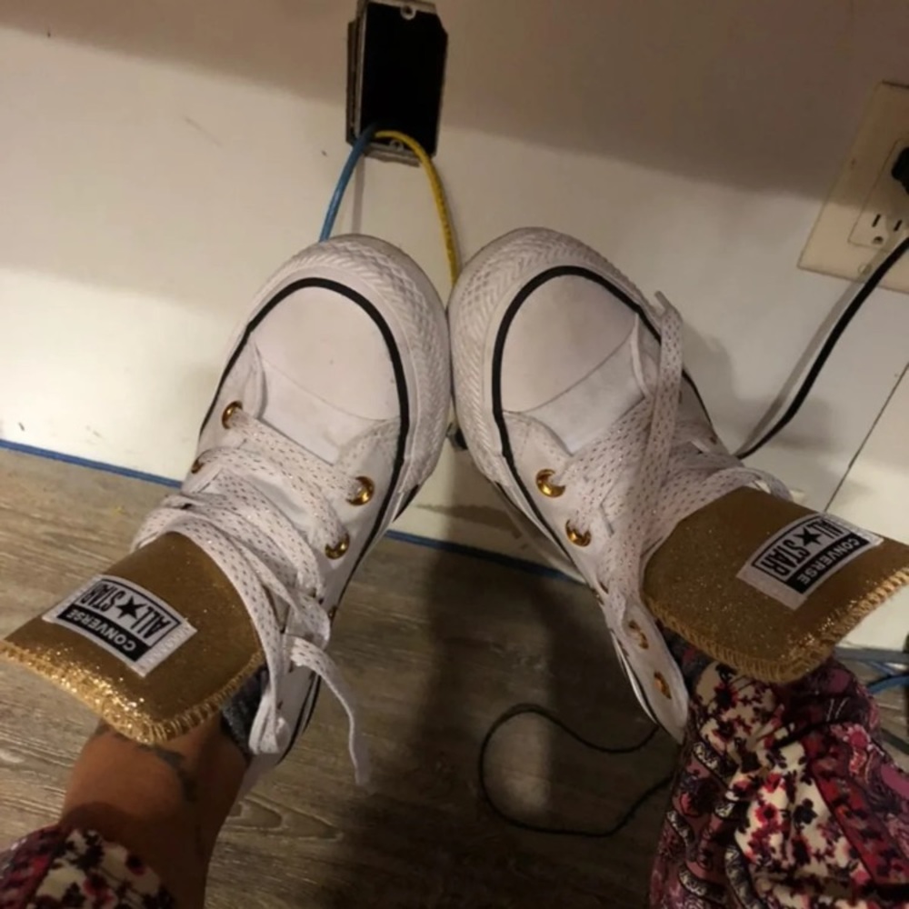 Gold and white converse